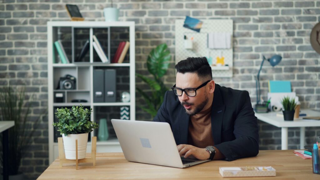 Smiling Man at Desk